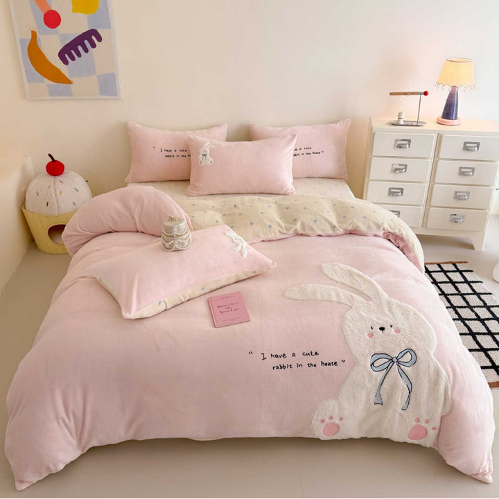 Cozy bedding set with embroidered rabbit appliqué and reversible cover