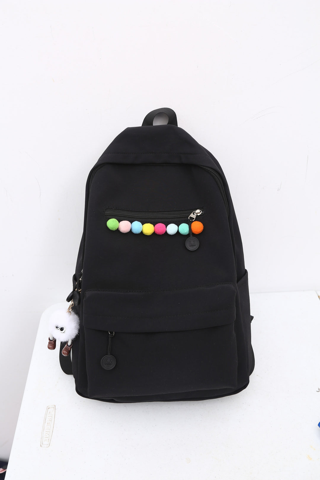 Practical backpack with colorful applications Kalsten