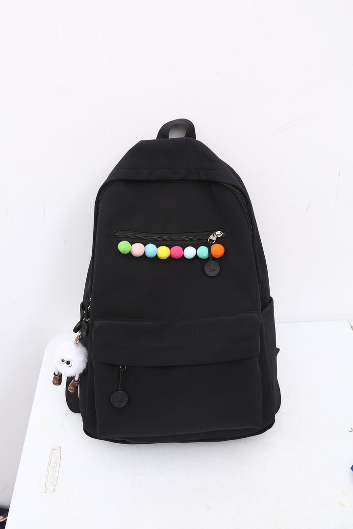 Practical backpack with colorful applications Kalsten