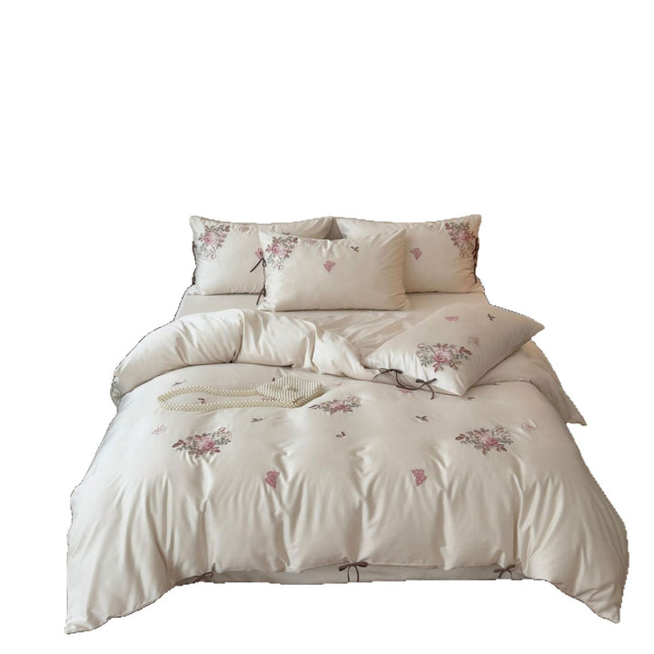 Silky-matte satin bedding set with embroidered rose bouquets and ties