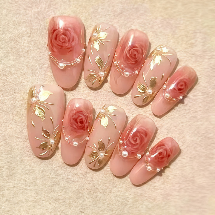 Artificial nail set with elegant rose and gold embellishments Kalsten
