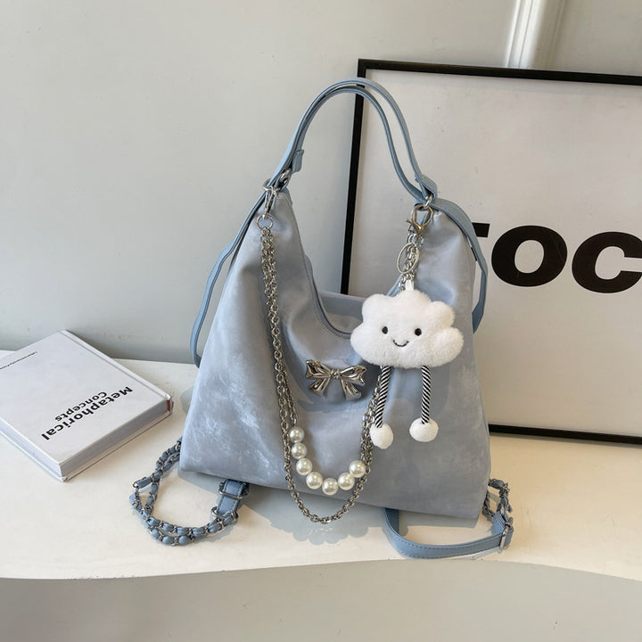 Fashionable handbag with unique pendant and chain accents Kalsten