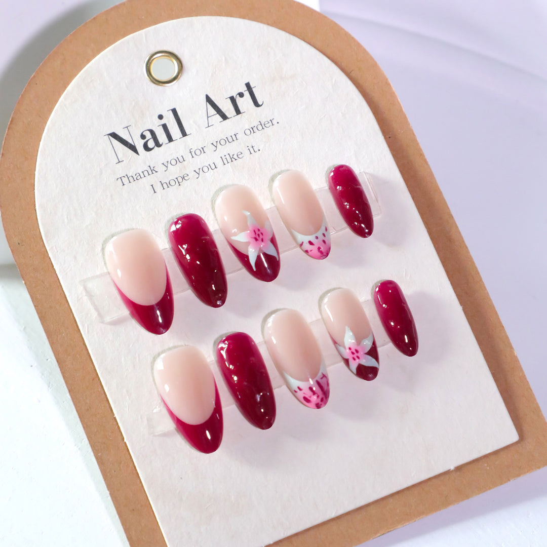 Artistic nail art with floral accents and glossy finish Kalsten