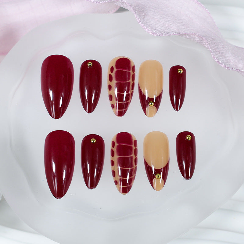 Acrylic nail set with elegant golden accents and trendy design Kalsten
