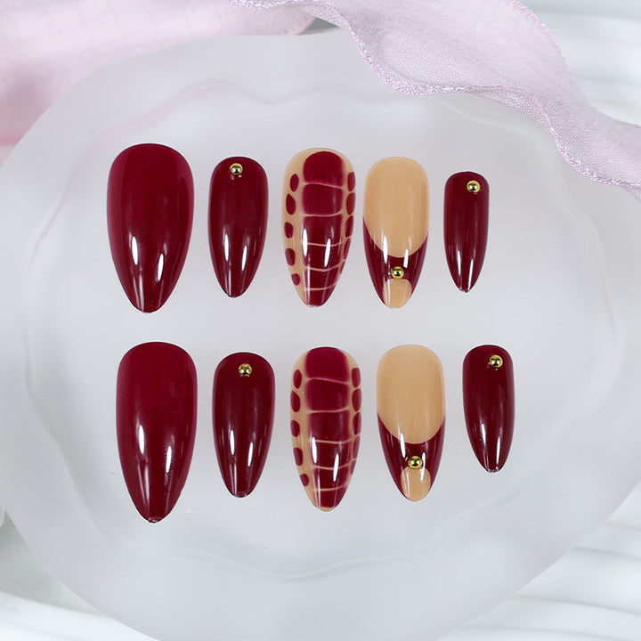 Acrylic nail set with elegant golden accents and trendy design Kalsten