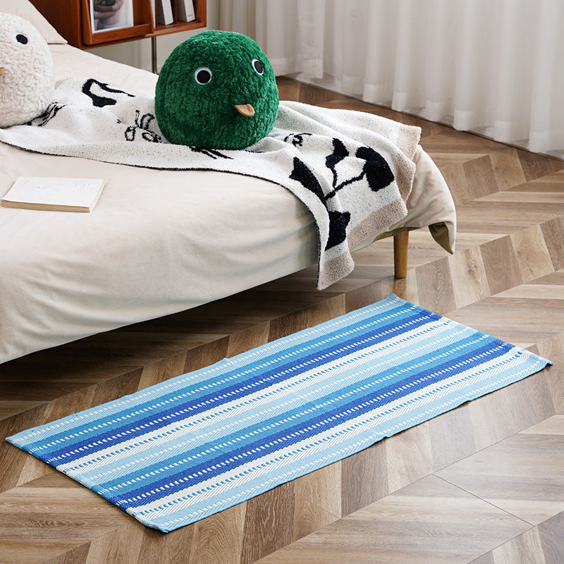 woven living room runner with fringes and geometric weave pattern