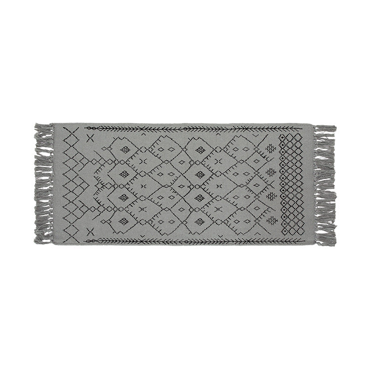 Woven cotton rug runner with flat weave structure, graphic diamond ethnic pattern and fringes