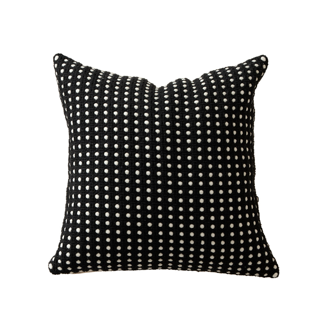 Woven decorative pillow with textured dot tufting