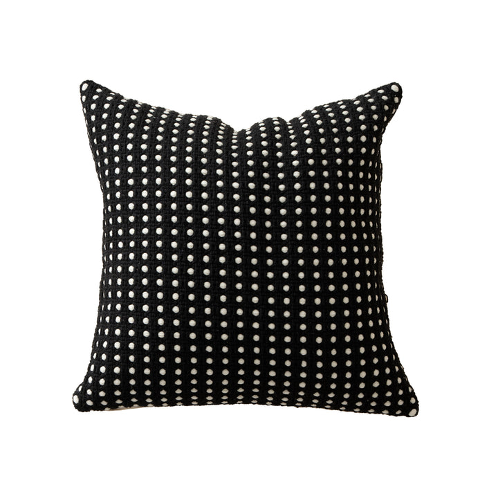 Woven decorative pillow with textured dot tufting