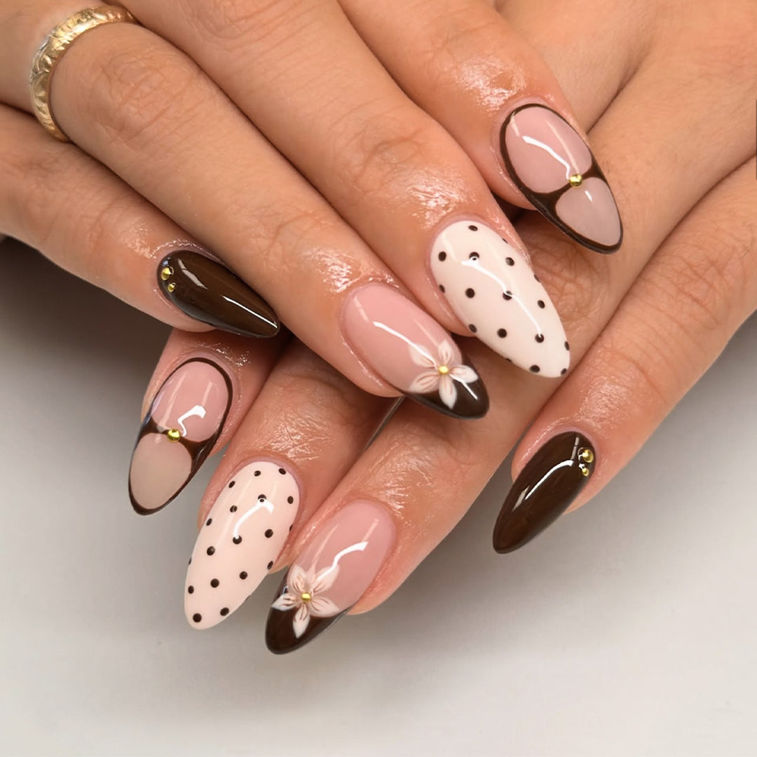 Artful nail design with floral and dot motifs Kalsten