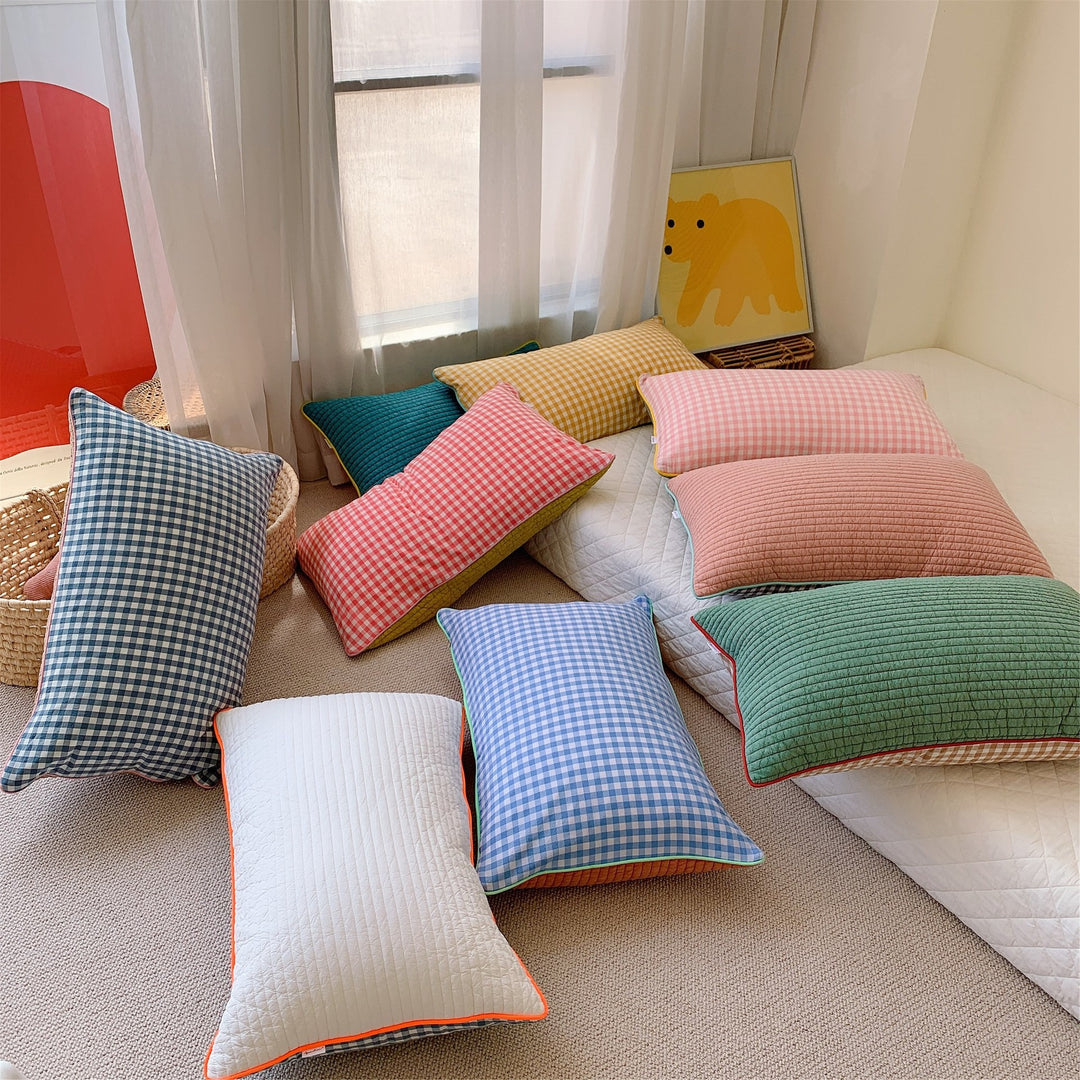 Reversible quilted pillow set with checked cotton cover and contrasting piping