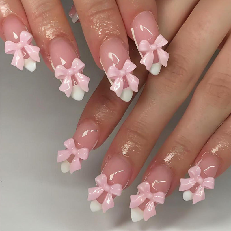 Acrylic nail set with playful bow decorations Kalsten