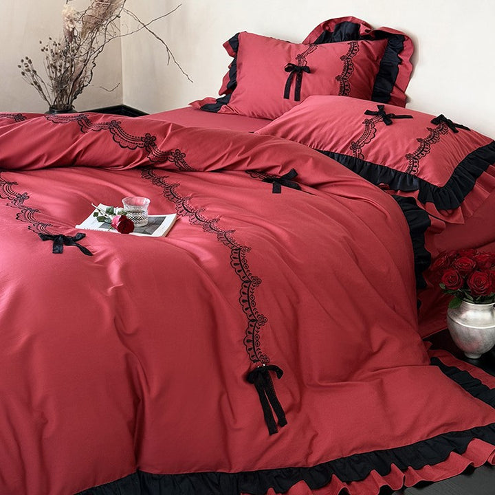 Luxurious satin bedding set with ruffles, lace embroidery and decorative bows