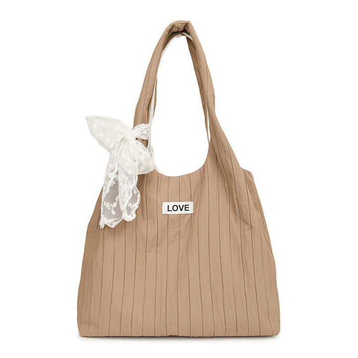 Leisure bag with structured design and playful scarf Kalsten