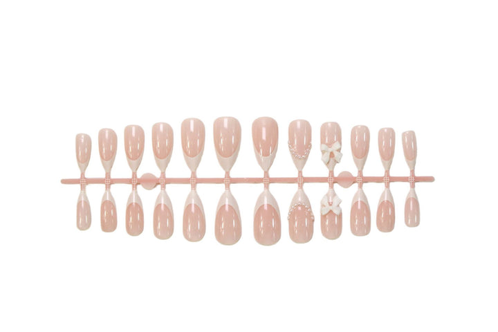 Acrylic nail set with elegant floral embellishments and trendy French tip Kalsten