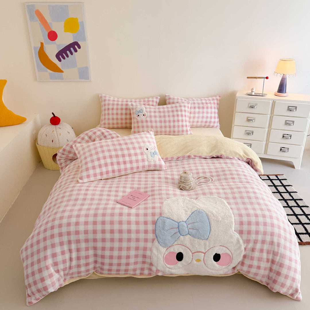 Cozy bedding set with embroidered rabbit appliqué and reversible cover