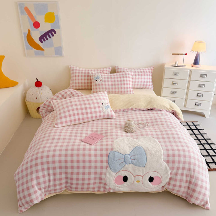 Cozy bedding set with embroidered rabbit appliqué and reversible cover