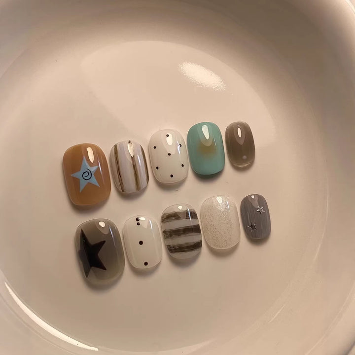 Artistic Press-On Nail Set with Geometric and Star Designs
