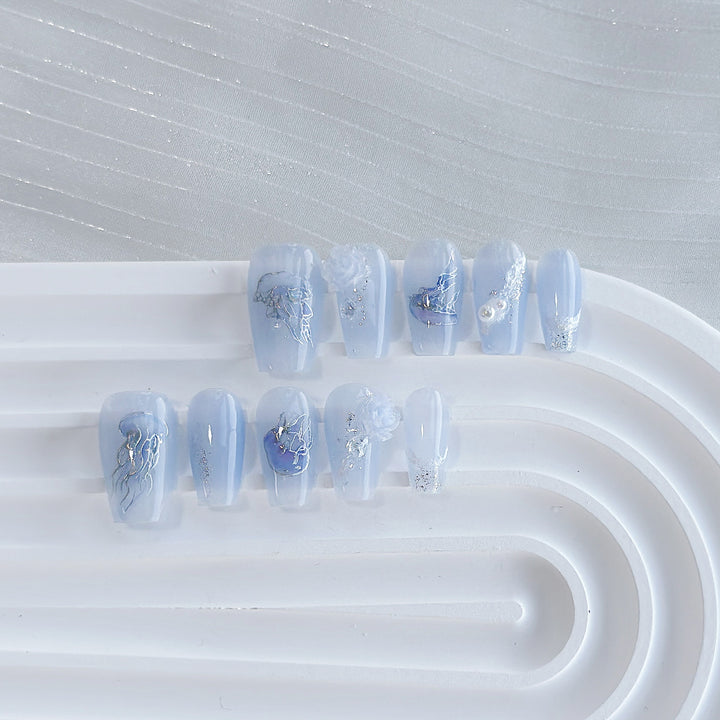 Artistic Press-On Nail Set with Sea-Inspired Designs
