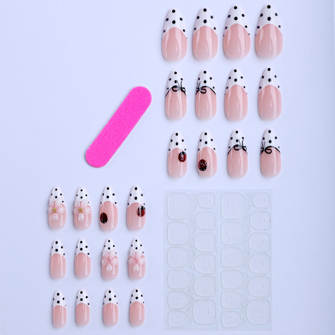 Artificial nail art with floral and playful accents Kalsten