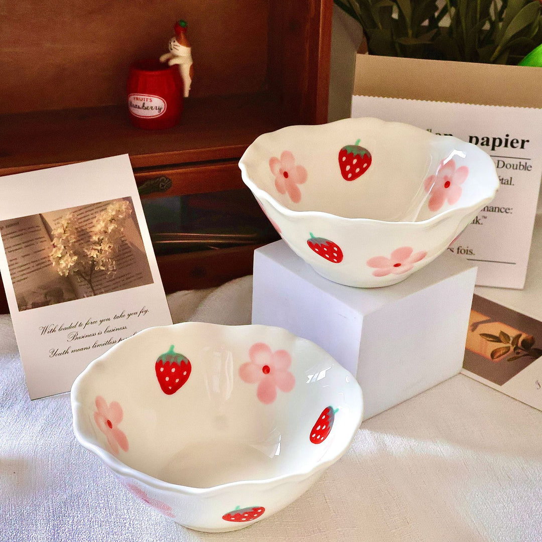 Decorative hand-painted ceramic bowl with wavy edge and tulip design