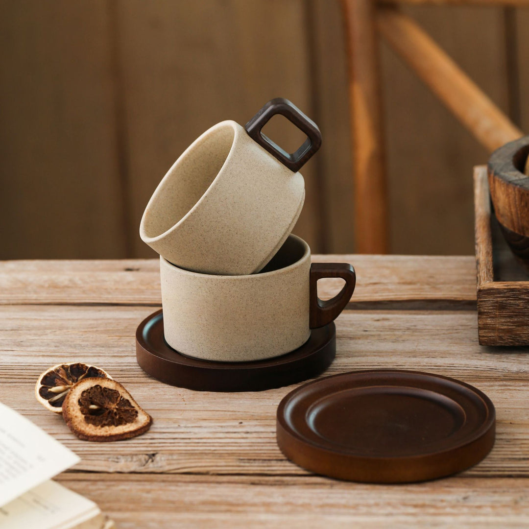Ceramic mug with wooden handle and saucer