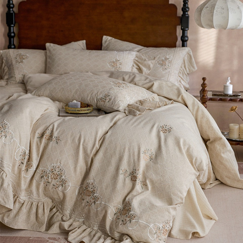 Romantic cotton bedding set with diamond jacquard, embroidered border, and gathered ruffle