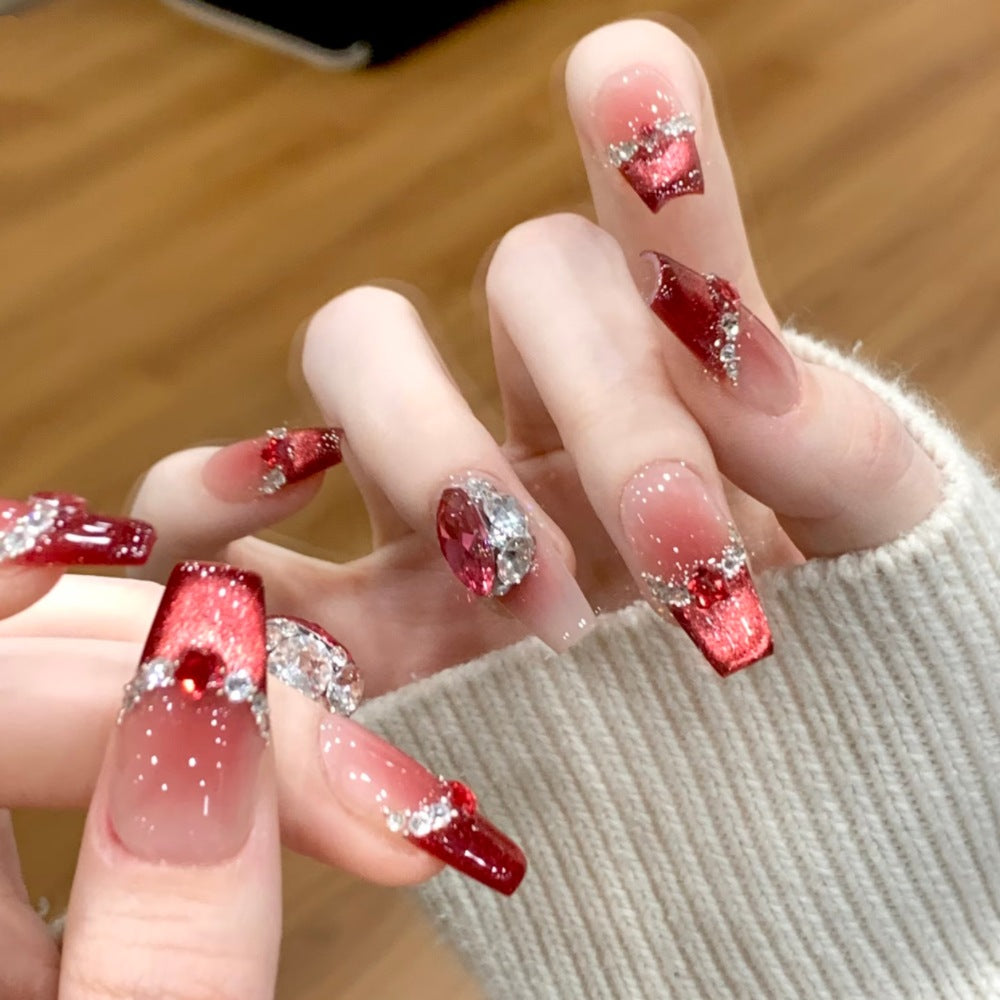 Glamorous artificial nails with sparkling rhinestone applications Kalsten