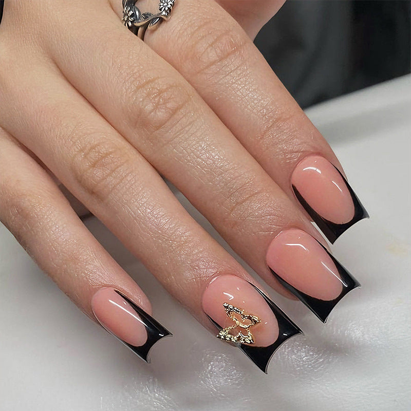 Artificial nails with elegant black and white tips and delicate accents Kalsten