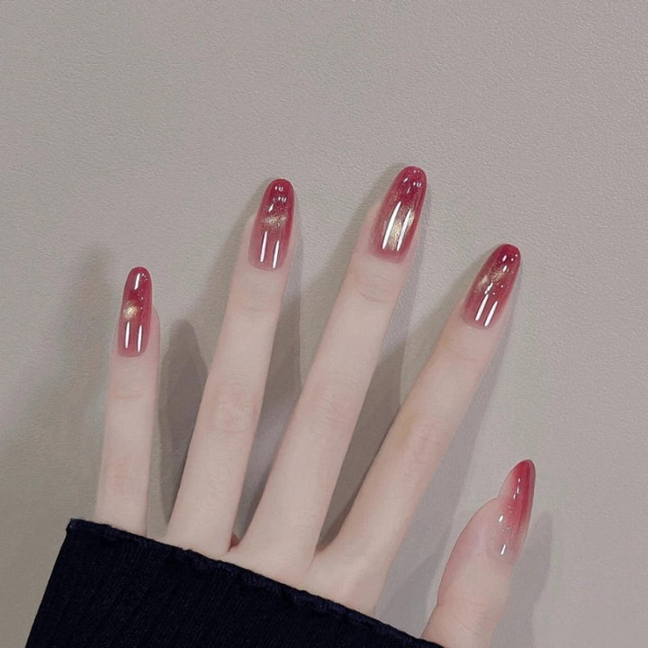 Glossy Ombre Nail Extensions with Gold Accents