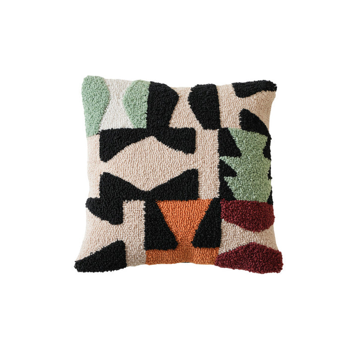 Hand-tufted decorative cushion with abstract graphic design and textured cotton surface