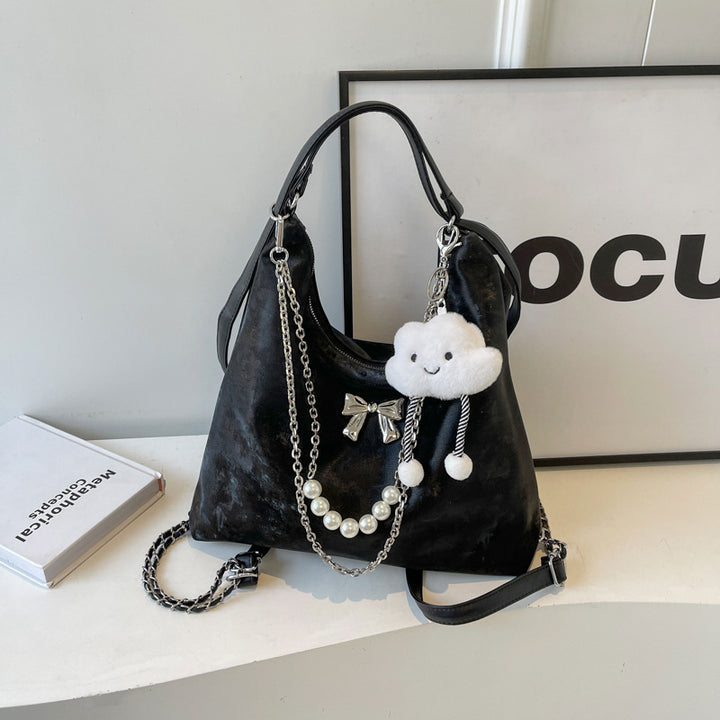 Fashionable handbag with unique pendant and chain accents Kalsten