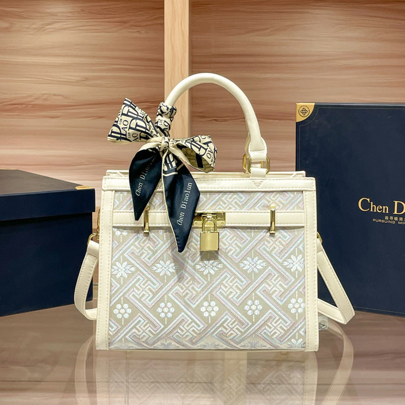 Elegant Designer Handbag with Decorative Bow