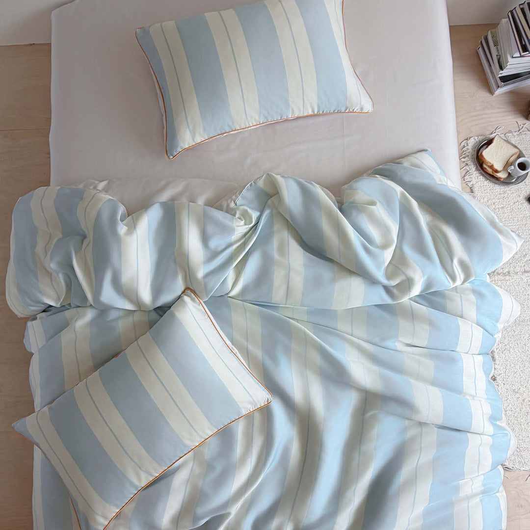 Luxurious cotton satin bedding set with fine striped pattern and piping