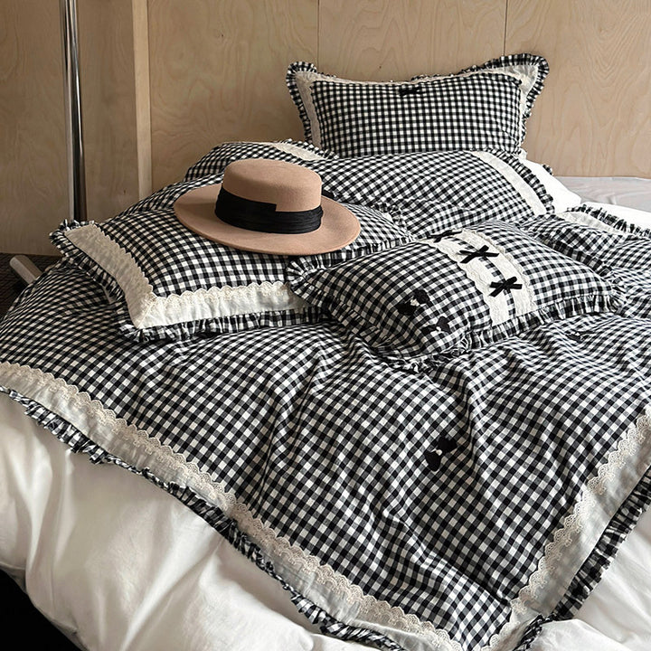 Bedding set in country house style with Vichy check, ruffle and embroidery appliqués