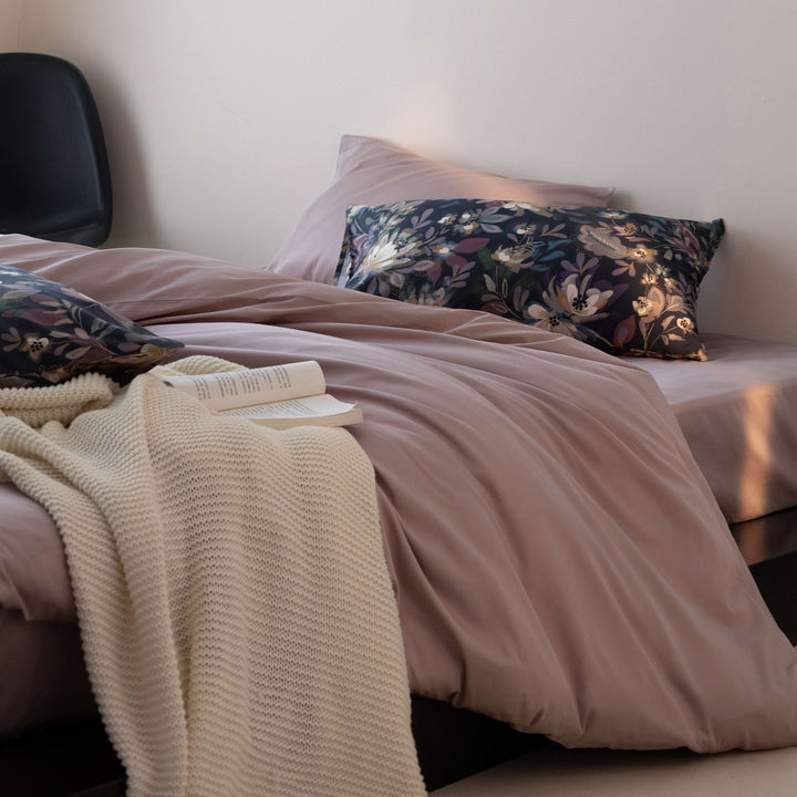 Luxurious cotton satin bedding set with contrasting patterned pillows