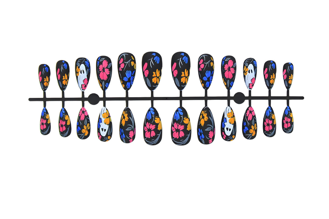 Artificial nail set with spooky Halloween design and colorful floral accents Kalsten