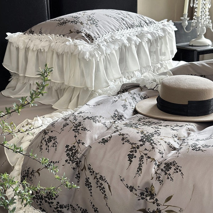 Satin bedding set with floral print duvet, tiered ruffle pillow & lace trim