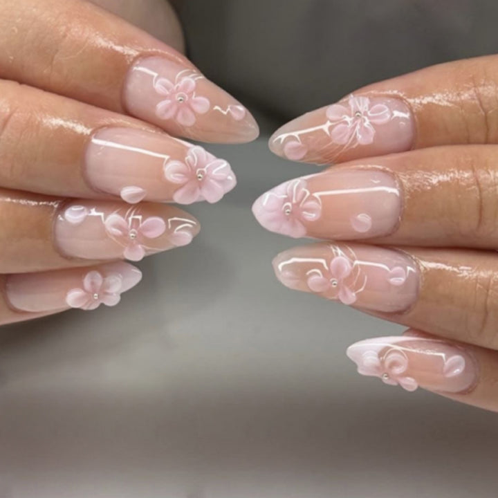 Artful stiletto nails with elegant floral design and glitter details Kalsten