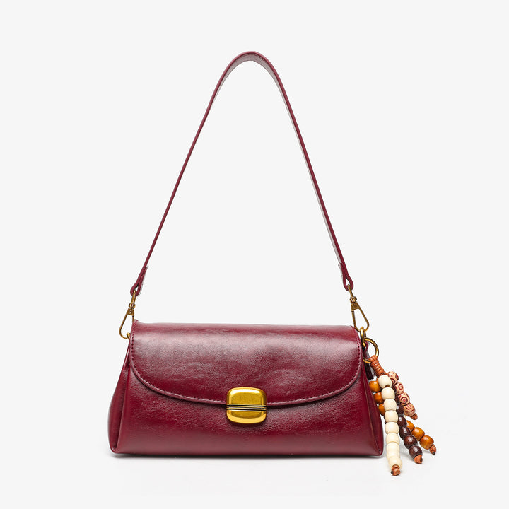 Elegant Handheld Shoulder Bag with Decorative Beaded Charm
