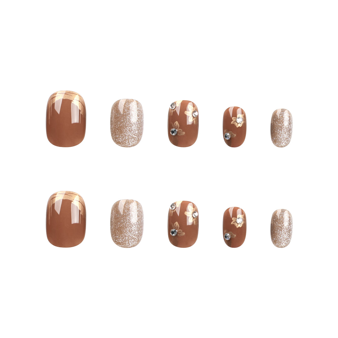 Elegant Nail Decoration with Glitter and Floral Accents Kalsten