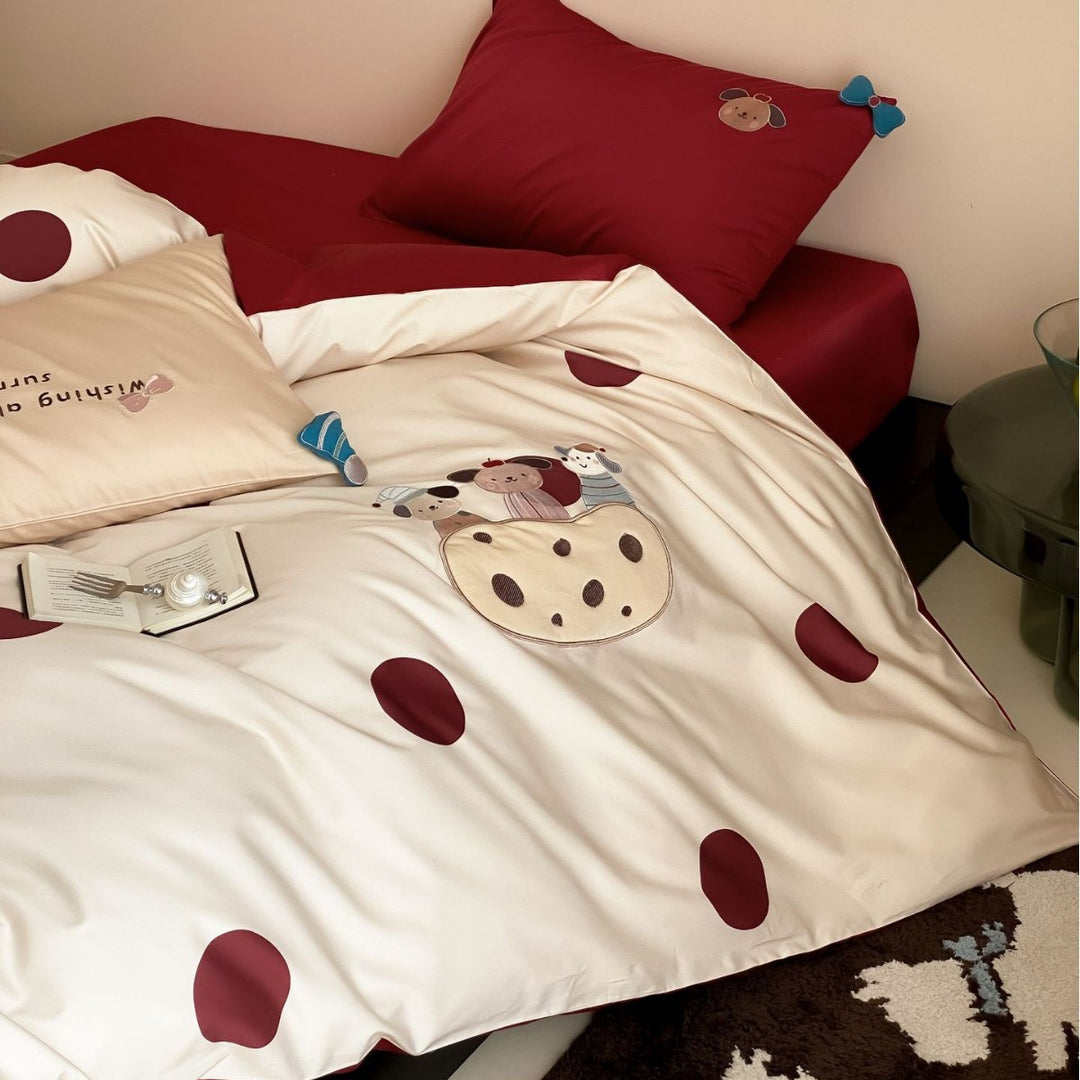 Children's bedding set with embroidered car applique and pompom detail
