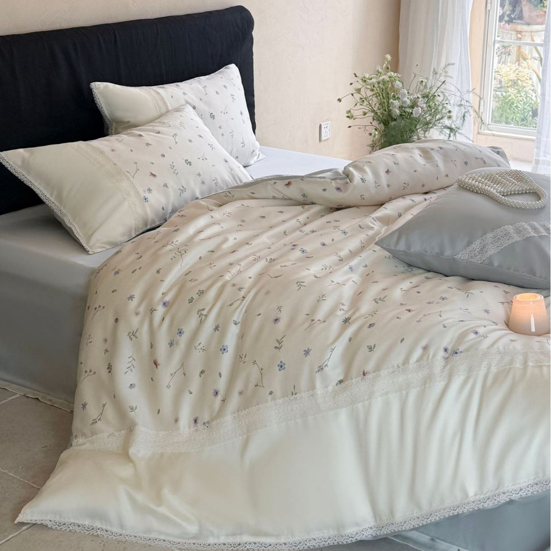 Cotton satin bedding set with delicate floral embroidery and lace trim