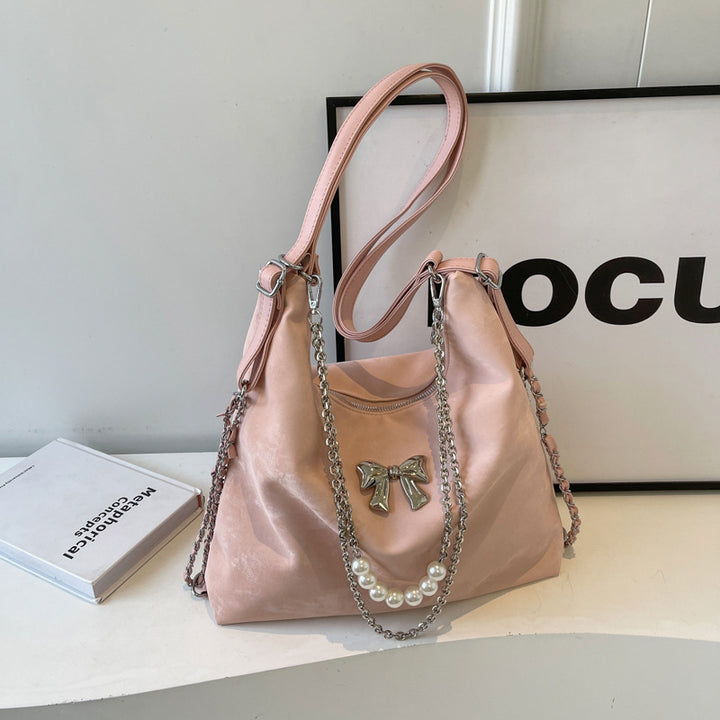 Fashionable handbag with unique pendant and chain accents Kalsten