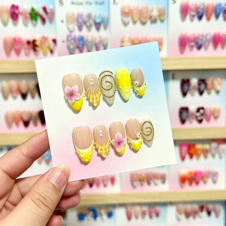 Artistic Press-On Nail Art Set with Floral and Shell Accents