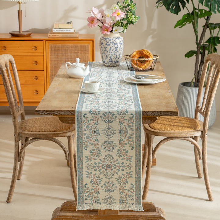 Woven runner with vintage-oriental floral pattern and fringes