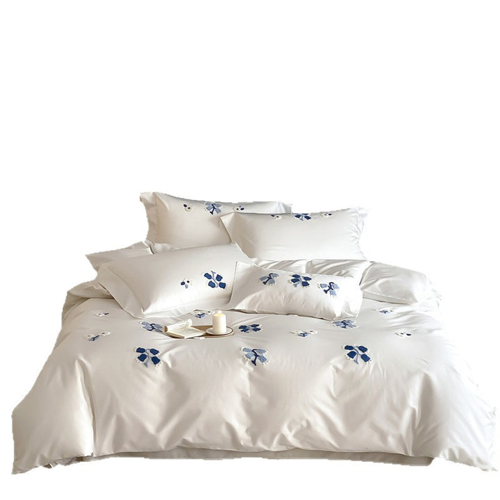 Embroidered cotton satin bedding set with subtle blue flower patterns