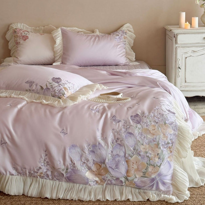 Luxurious embroidered satin bedding set with ruffles and floral details