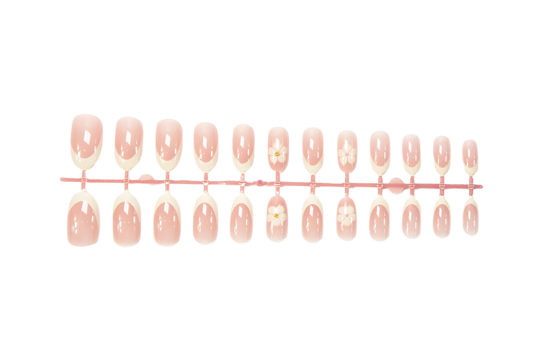 Artificial nail set with elegant flower and French tip embellishments Kalsten