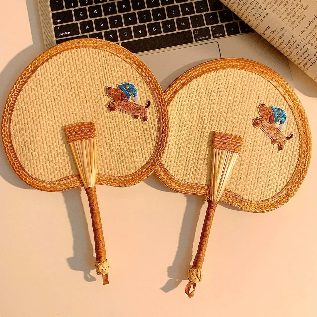 Handcrafted fan with playful dog motif Kalsten